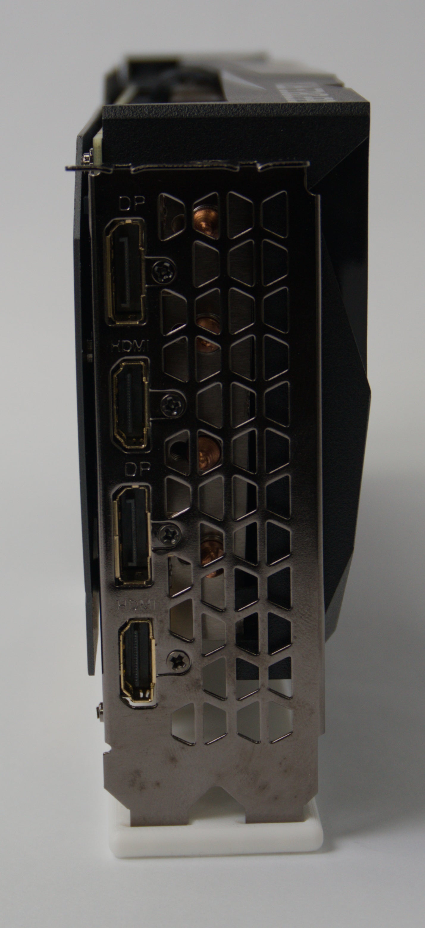 IO panel view of a black graphics card showing multiple video output ports, including HDMI and DisplayPort.
