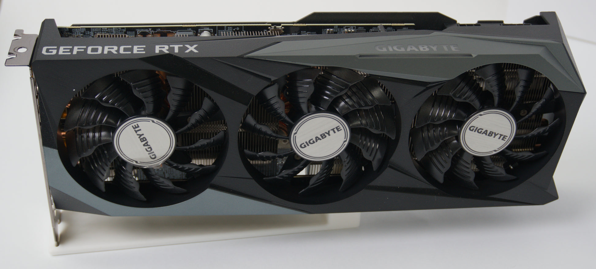 A Gigabyte RTX 3070 8GB graphics card with a three-fan cooling system, shown from a three-quarter angle on a white background.