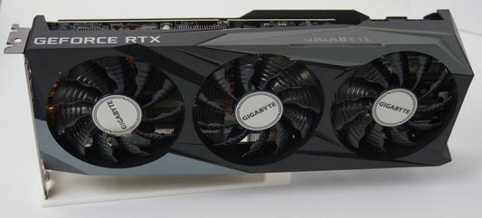 A Gigabyte RTX 3070 8GB graphics card with a three-fan cooling system, shown from a three-quarter angle on a white background.