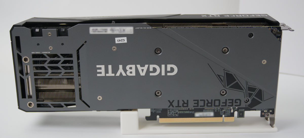 Back side of the GIGABYTE GeForce RTX graphics card with a dark gray and black design, featuring the GIGABYTE logo in white.